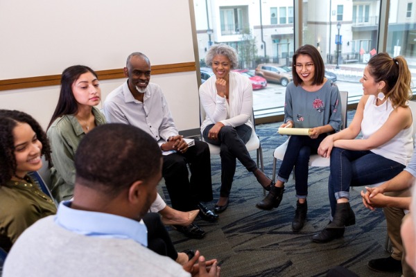 therapy group enjoys lighthearted session picture id1137620268